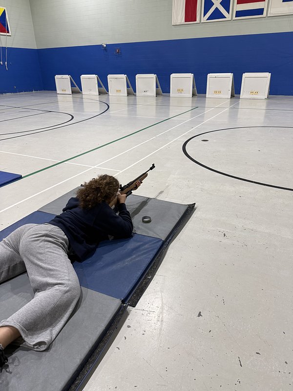 A cadet steadying a target rifle on the range